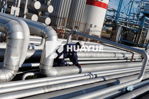Cellular glass pipe insulation installed on chemical plant steam pipeline in outdoor weather