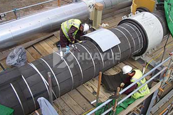 Foam glass pipe insulation installed around straight industrial piping